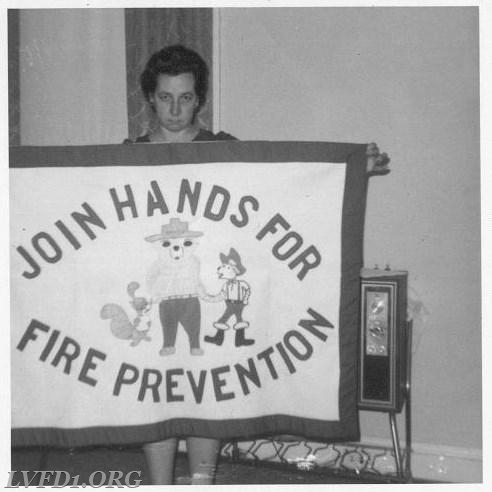 1969: Mary Jane Scully displays her awarding winning fire prevention banner.